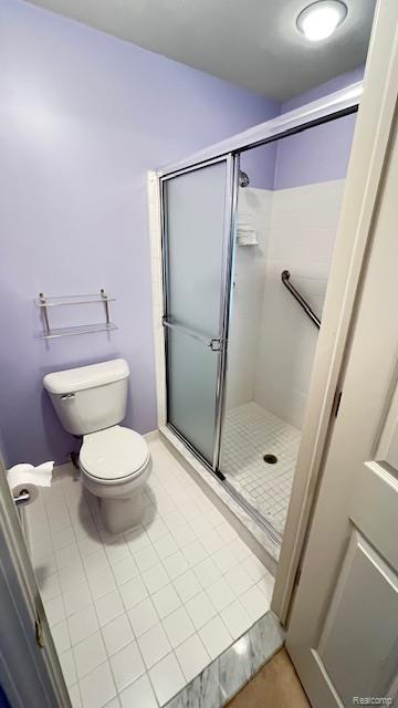 43573 E Perignon Dr N, Sterling Heights, MI 48314 - full bath with tile patterned flooring, toilet, and a stall shower