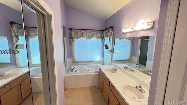 43573 E Perignon Dr N, Sterling Heights, MI 48314 - bathroom featuring lofted ceiling, double vanity, and a garden tub