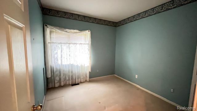 43573 E Perignon Dr N, Sterling Heights, MI 48314 - spare room featuring baseboards