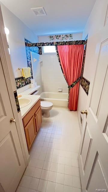 43573 E Perignon Dr N, Sterling Heights, MI 48314 - full bathroom featuring vanity, shower / tub combo, toilet, and tile patterned flooring