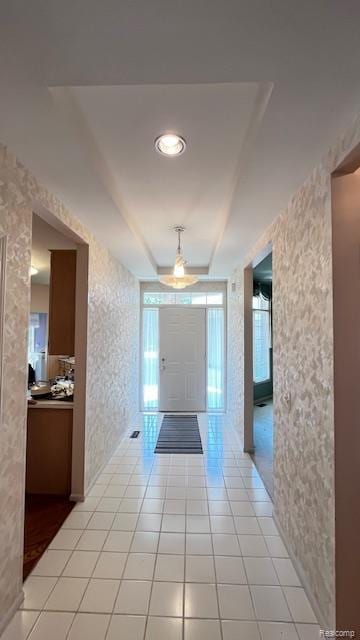 43573 E Perignon Dr N, Sterling Heights, MI 48314 - corridor with wallpapered walls, light tile patterned flooring, and a tray ceiling