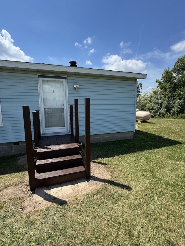 3828 90th Ave, Evart, MI 49631 - doorway to property with crawl space and a lawn