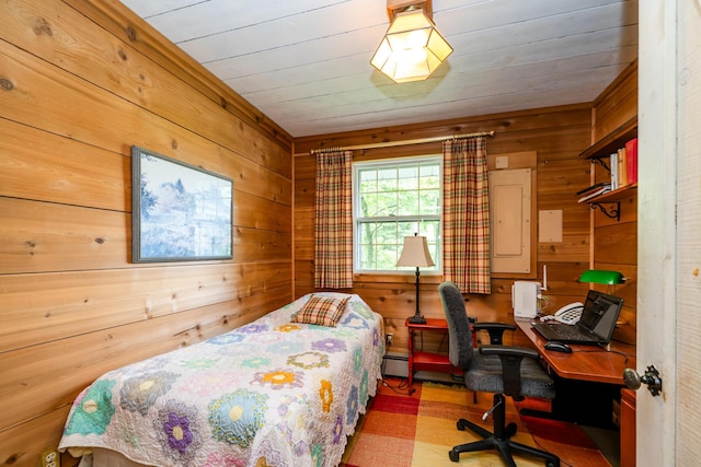2900 Boyer Rd, Coloma, MI 49038 - bedroom with wood walls, an office area, and a baseboard radiator