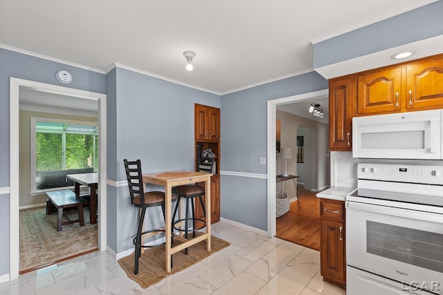603 Outer Dr, Tecumseh, MI 49286 - kitchen with white appliances, light marble finish flooring, baseboards, brown cabinetry, and ornamental molding