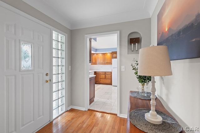 603 Outer Dr, Tecumseh, MI 49286 - entrance foyer featuring light wood finished floors and baseboards