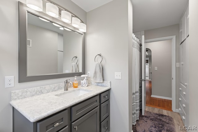603 Outer Dr, Tecumseh, MI 49286 - bathroom with vanity and wood finished floors