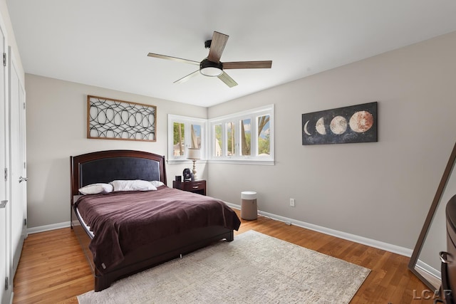 603 Outer Dr, Tecumseh, MI 49286 - bedroom featuring wood finished floors, baseboards, and a ceiling fan