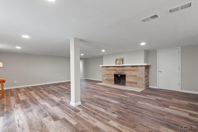 603 Outer Dr, Tecumseh, MI 49286 - finished below grade area featuring wood finished floors, recessed lighting, baseboards, and a fireplace