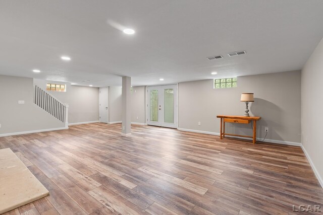 603 Outer Dr, Tecumseh, MI 49286 - basement featuring recessed lighting, wood finished floors, baseboards, and stairway