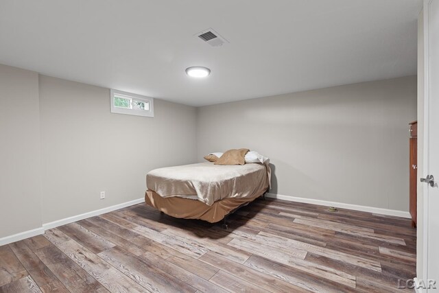 603 Outer Dr, Tecumseh, MI 49286 - bedroom with wood finished floors and baseboards