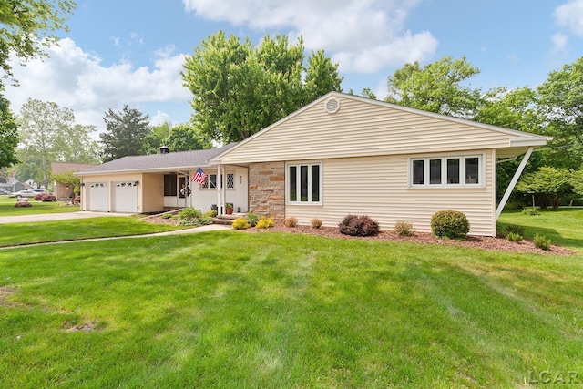 603 Outer Dr, Tecumseh, MI 49286 - ranch-style home featuring an attached garage, driveway, and a front yard