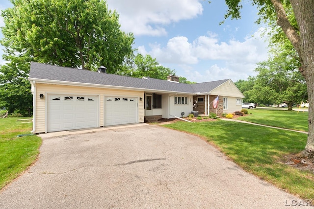 603 Outer Dr, Tecumseh, MI 49286 - single story home with driveway, a garage, a chimney, and a front yard