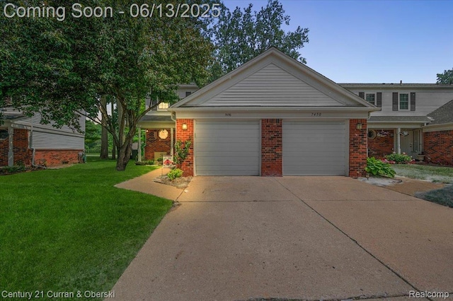 7456 N Kingston Ct, Westland, MI 48185 - traditional-style home with an attached garage, brick siding, a front lawn, and driveway