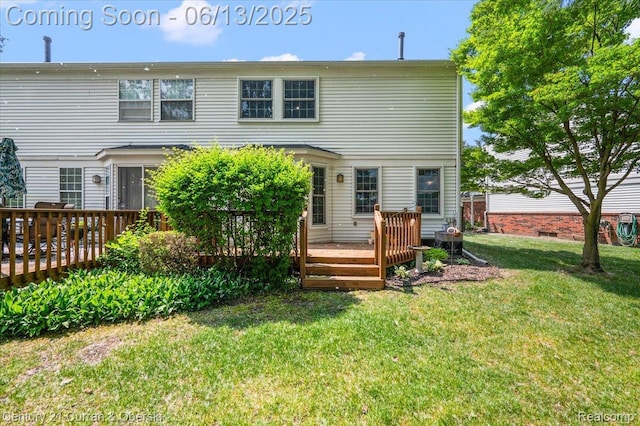 7456 N Kingston Ct, Westland, MI 48185 - back of property with a wooden deck and a lawn