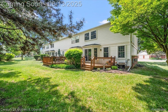 7456 N Kingston Ct, Westland, MI 48185 - rear view of house with a wooden deck and a yard