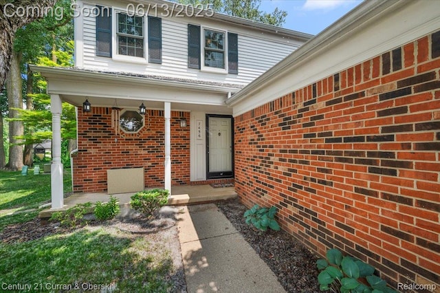 7456 N Kingston Ct, Westland, MI 48185 - property entrance with brick siding and covered porch