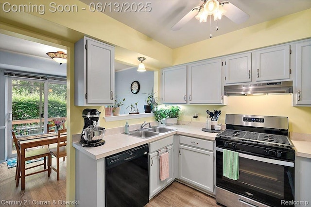 7456 N Kingston Ct, Westland, MI 48185 - kitchen featuring stainless steel gas range, dishwasher, under cabinet range hood, and light countertops