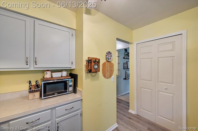 7456 N Kingston Ct, Westland, MI 48185 - kitchen featuring wood finished floors and light countertops