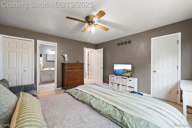 7456 N Kingston Ct, Westland, MI 48185 - bedroom with light colored carpet, ensuite bath, and a ceiling fan