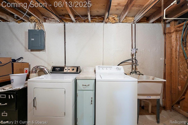 7456 N Kingston Ct, Westland, MI 48185 - washroom with electric panel and independent washer and dryer