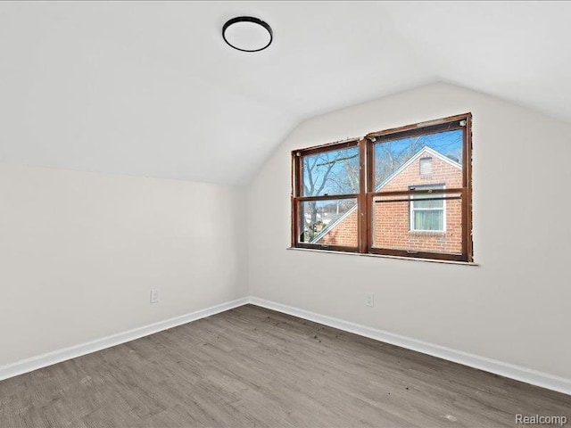 19468 Evergreen Rd, Detroit, MI 48219 - additional living space featuring wood finished floors, vaulted ceiling, and baseboards