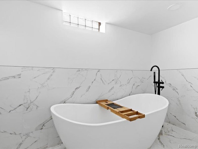 19468 Evergreen Rd, Detroit, MI 48219 - full bath featuring marble tiled floors, a soaking tub, tile walls, and wainscoting