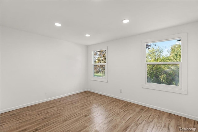 9207 Stout St, Detroit, MI 48228 - spare room featuring plenty of natural light, wood finished floors, baseboards, and recessed lighting