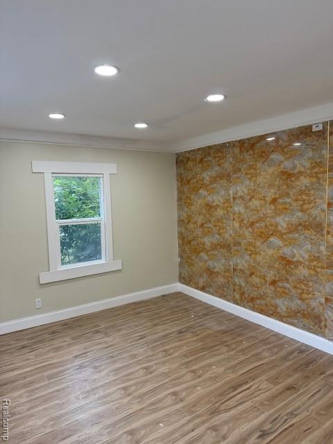 9207 Stout St, Detroit, MI 48228 - unfurnished room featuring wood finished floors, baseboards, and recessed lighting