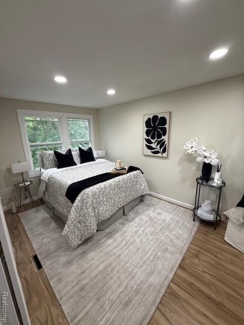 9207 Stout St, Detroit, MI 48228 - bedroom featuring wood finished floors, recessed lighting, and baseboards