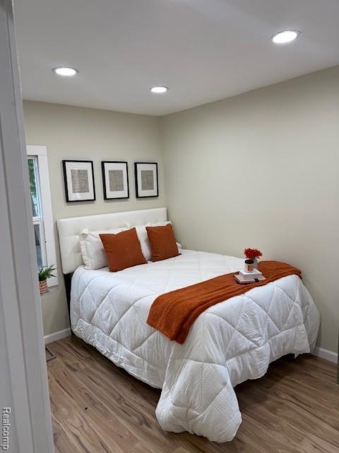 9207 Stout St, Detroit, MI 48228 - bedroom with wood finished floors, baseboards, and recessed lighting