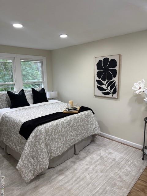 9207 Stout St, Detroit, MI 48228 - bedroom with wood finished floors, baseboards, and recessed lighting