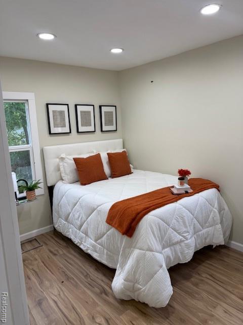 9207 Stout St, Detroit, MI 48228 - bedroom with baseboards, wood finished floors, and recessed lighting