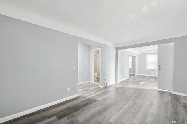 5932 Colorado St, Romulus, MI 48174 - spare room featuring baseboards and wood finished floors