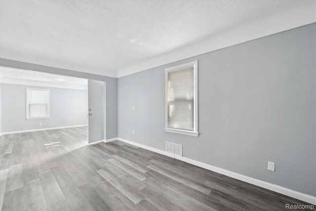 5932 Colorado St, Romulus, MI 48174 - empty room with wood finished floors and baseboards