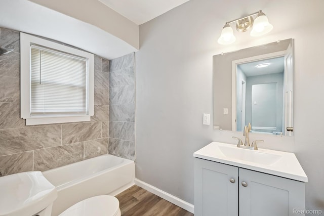 5932 Colorado St, Romulus, MI 48174 - full bath with wood finished floors, toilet, vanity, and baseboards