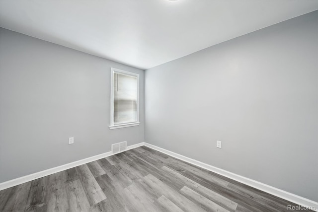 5932 Colorado St, Romulus, MI 48174 - spare room featuring wood finished floors and baseboards