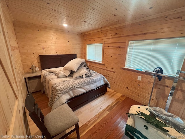 11755 Jakob Ln, Lachine, MI 49753 - bedroom with wood walls, wood finished floors, and wooden ceiling