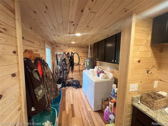 11755 Jakob Ln, Lachine, MI 49753 - laundry room with washing machine and clothes dryer, wood walls, light wood-type flooring, cabinet space, and wood ceiling