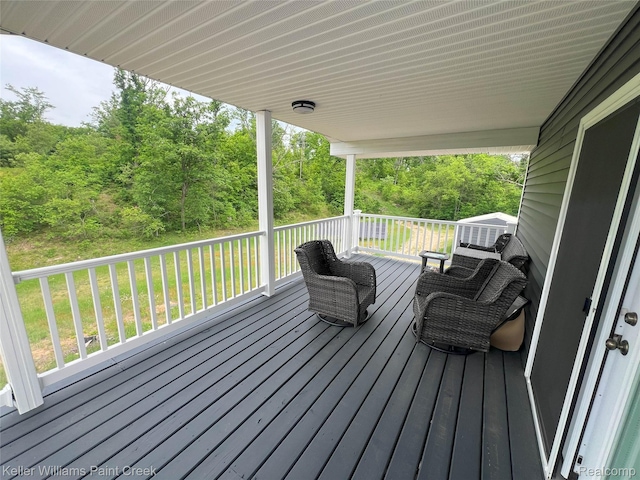 11755 Jakob Ln, Lachine, MI 49753 - wooden deck with a wooded view