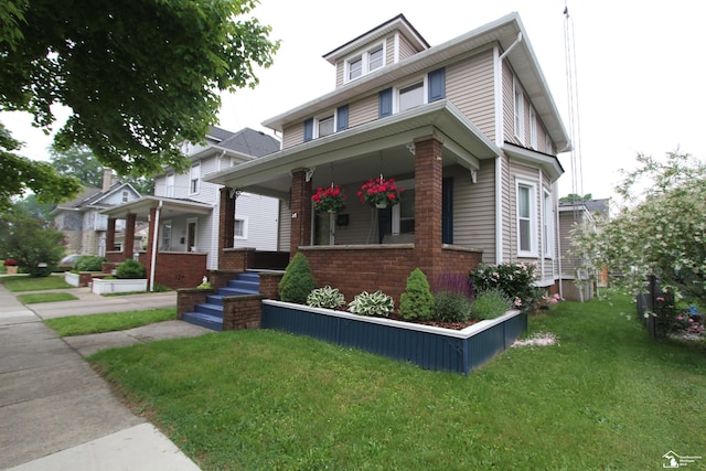 633 Scott St, Monroe, MI 48161 - american foursquare style home with covered porch and a front yard