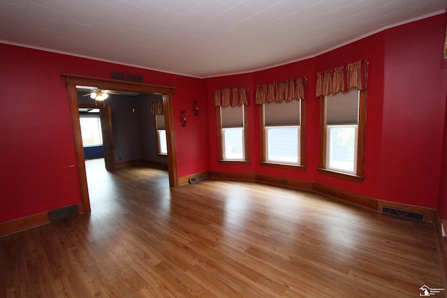 633 Scott St, Monroe, MI 48161 - spare room with ornamental molding, wood finished floors, and baseboards
