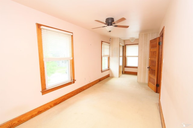 633 Scott St, Monroe, MI 48161 - empty room featuring light carpet, a ceiling fan, and baseboards