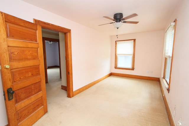 633 Scott St, Monroe, MI 48161 - spare room with light carpet, ceiling fan, and baseboards