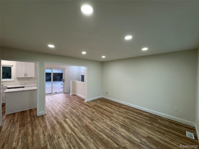 42113 Clayton St, Clinton Township, MI 48038 - unfurnished living room with dark wood finished floors, recessed lighting, and baseboards