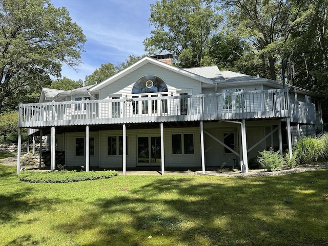 9679 Almena Dr, Kalamazoo, MI 49009 - back of house with a deck, a lawn, and a chimney