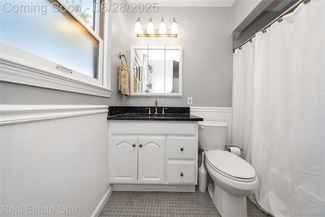 4507 Groveland Ave, Royal Oak, MI 48073 - full bath with vanity, a wainscoted wall, healthy amount of natural light, and tile patterned flooring
