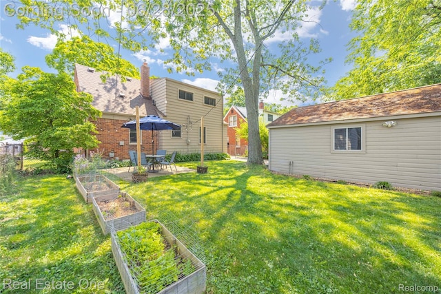4507 Groveland Ave, Royal Oak, MI 48073 - view of yard featuring a vegetable garden and a patio area