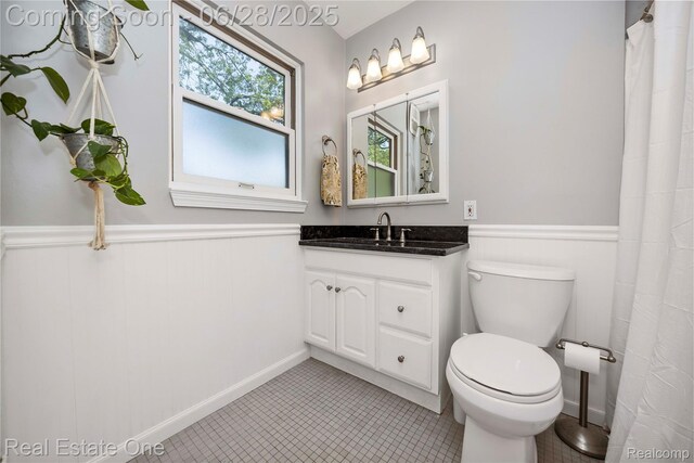 4507 Groveland Ave, Royal Oak, MI 48073 - bathroom featuring wainscoting, vanity, and tile patterned flooring