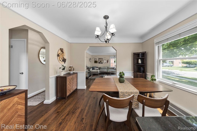 4507 Groveland Ave, Royal Oak, MI 48073 - dining room featuring arched walkways, dark wood-style floors, a chandelier, and healthy amount of natural light
