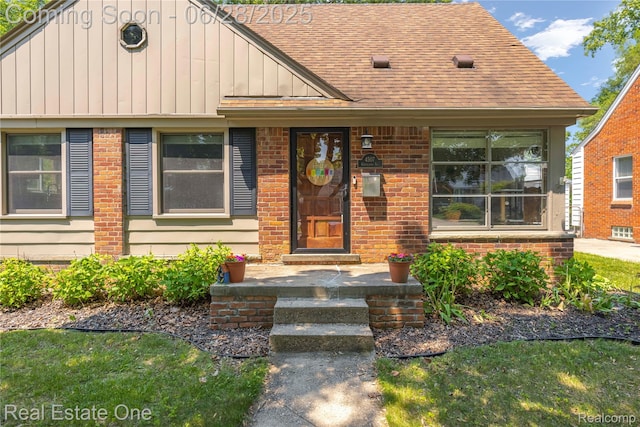 4507 Groveland Ave, Royal Oak, MI 48073 - view of front of home with board and batten siding, brick siding, and roof with shingles